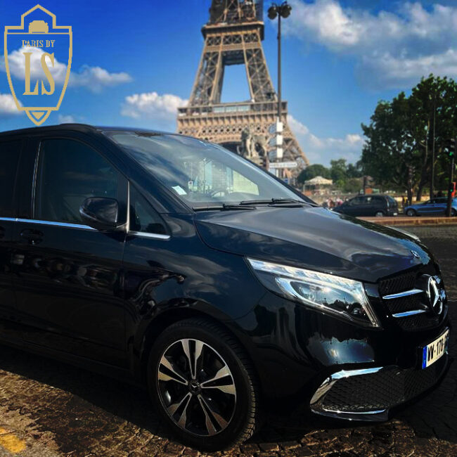 V class Mercedes in front of the Eiffel tower. car rental for 7 passengers in paris city tour.