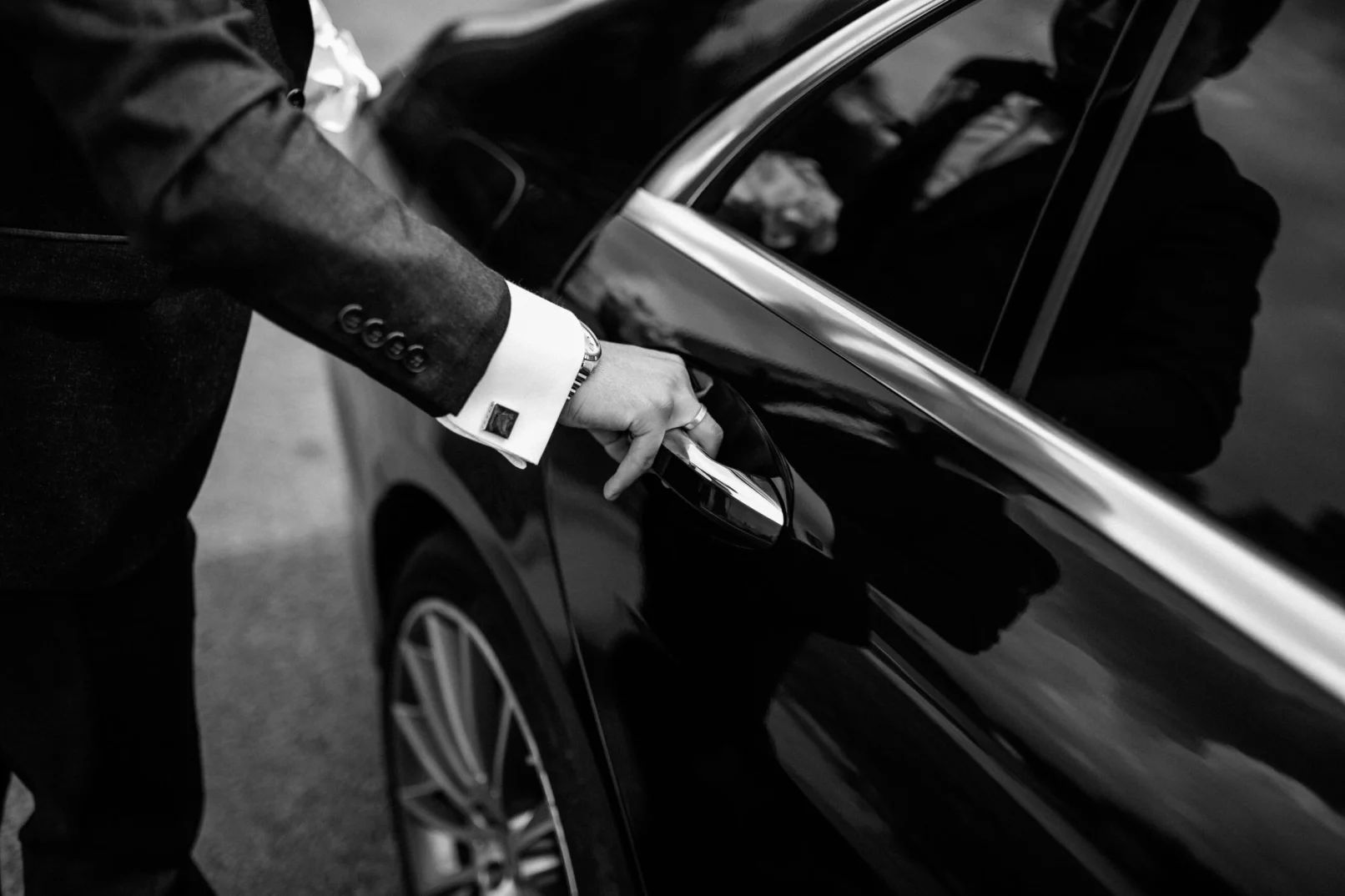 chauffeur opening the door